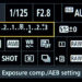 How do I change exposure compensation in manual mode?