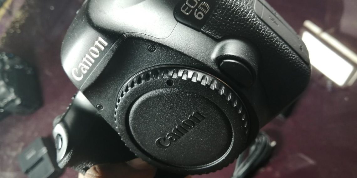 How do I check the firmware on my Canon EOS 80D?