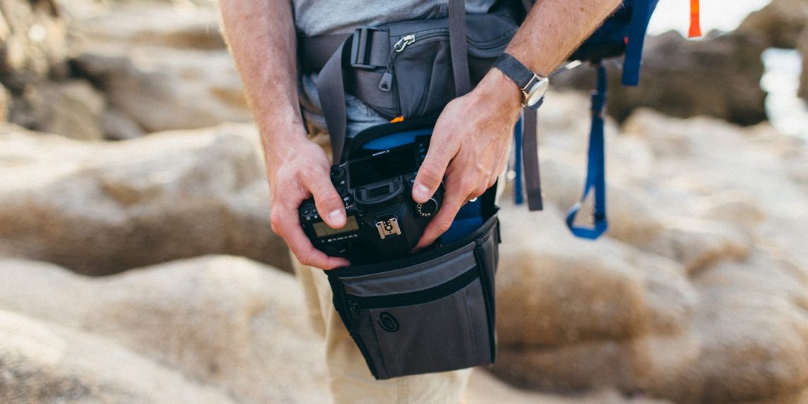 How do you carry a camera while hiking?