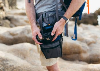 How do you carry a camera while hiking?