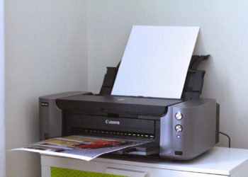 How do you put paper in a Pixma Pro 100?