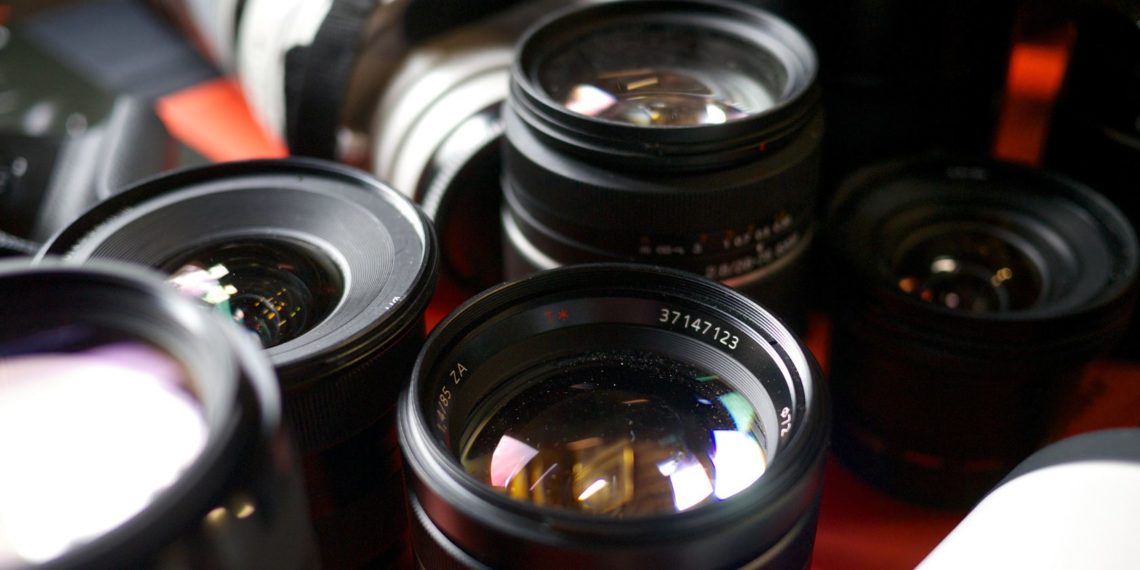 What are the disadvantages of a zoom lens?