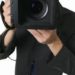 What kind of lens do professional photographers use?