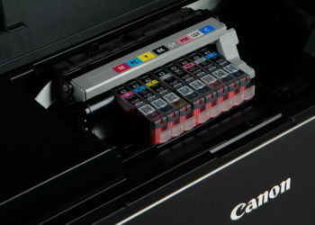 What type of ink does Canon Pro 100 use?